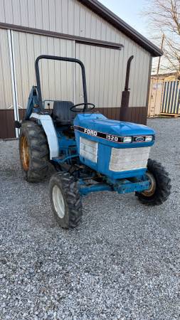Ford 1520 4 WD with backhoe 1