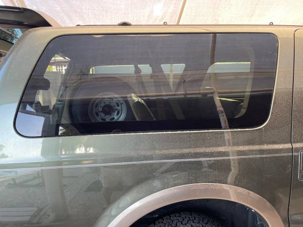 Ford Excursion right rear vent window and frame 1