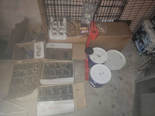 Wine making equipment and bottles to make it. 1