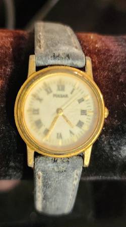 Ladies Gold Tone Pulsar Quartz Watch With Roman Numerals and Black Lea 1