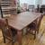 Beautiful Walnut dining room table and chairs. 1 thumbnail