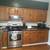 Oak kitchen cabinets + granite countertops + sink 2 thumbnail
