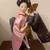 Japanese Geisha doll  wearing a pink  floral kimono with a golden fan 7 thumbnail