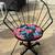 Pair of Metal Patio Swivel Chairs with Tropical Floral Cushions 3 thumbnail
