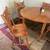 50’s solid wood dining table w/4 chairs and 2 leafs 1 thumbnail