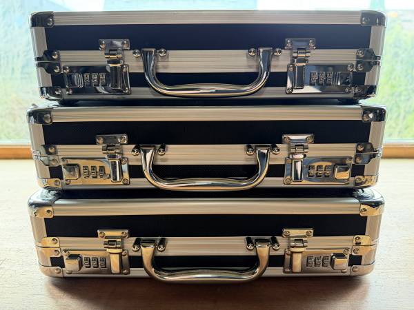 Three Vaultz locking DVD binder cases 1