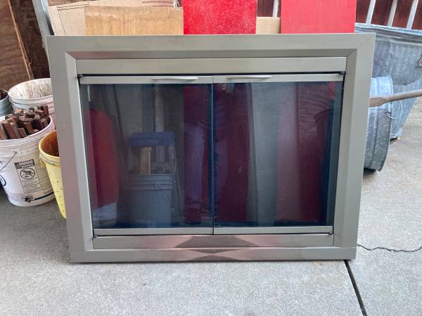 Metal Fireplace screen with glass doors. 1