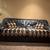 black leather and gold/black diamond-pattern fabric sofa 1 thumbnail