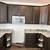 Kitchen cabinets with appliances and granite countertop 4 thumbnail
