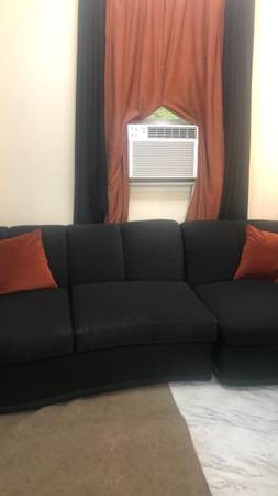 Black curved sectional sofa