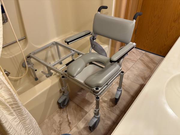 Nuprodx MC6000 Commode Chair with Tub Access Slider. 1