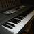 Yamaha EZ-200 61-Key Full-Size Touch Sensitive Lighted Keyboard &Stand 1 thumbnail