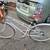 Stylish small/medium white Public bicycle with a front basket. 1 thumbnail