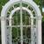 Garden arch with metal filigree double door, and built in planters 10 thumbnail