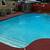 Fence in backyard with a beautiful in ground pool. 2 thumbnail
