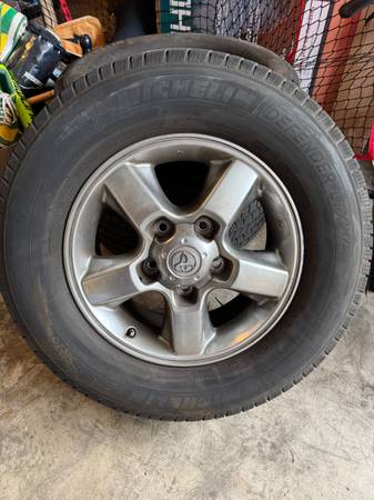 4 stock 18" toyota rims 275/65/18 Michelin defender tires 1