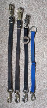 A group of four adjustable nylon strap trailer ties 1