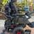 Red and black Quantum power wheelchair with joystick controller, adju 3 thumbnail