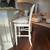 Four bar stools in light grey color. Cushions included. 1 thumbnail