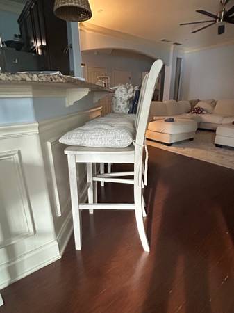 Four bar stools in light grey color. Cushions included. 1