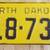 North Dakota 1948 Yellow License Plate # B18-731 1 thumbnail