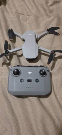 DJI Mini 4K with three batteries and multi-charger. 1