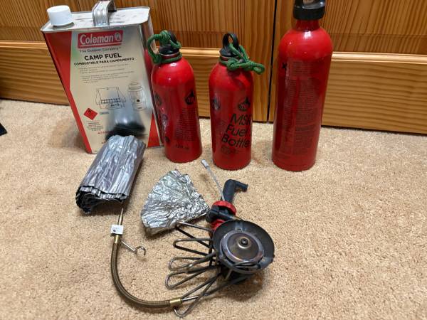 MSR Whisperlite stove, 3 fuel bottles, 5 gal white gas 1