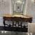Carved wood console table with a marble top 1 thumbnail