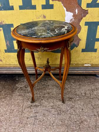 French marble top table with metal embellishments. Beautiful condition. 30" tall 1