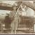 WWI Photograph of Soldier Holding Saber with Rifle and Pistol at Side 1 thumbnail