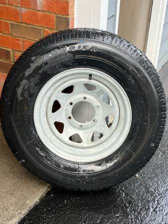 235/80r16.  LoadStar Karrier Brand New 10 ply trailer tire & wheel 1