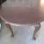 OVAL WOOD TABLE ON CASTER WHEELS WITH 4 CHAIRS 1 thumbnail