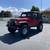 Adventure-Ready 1997 Jeep Wrangler Sport in Vibrant Red 10 thumbnail