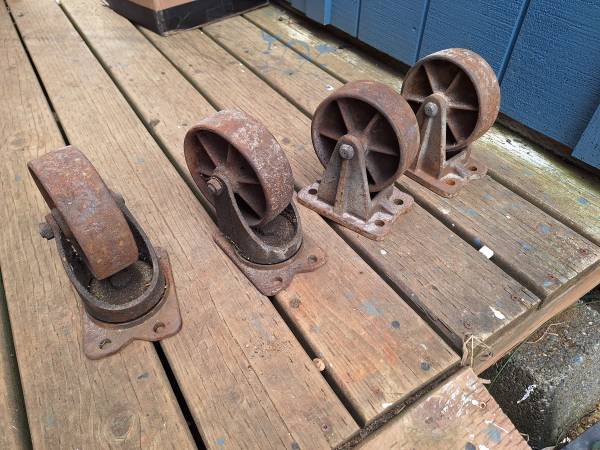 VINTAGE SOLID IRON CASTERS 1