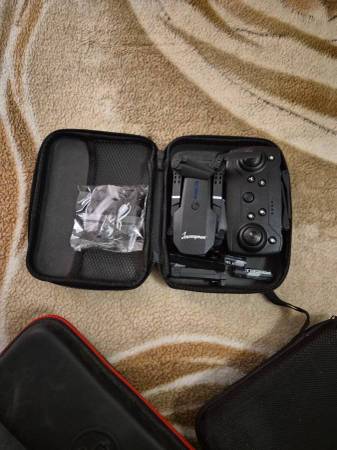 Journeyman branded E88 Pro foldable quadcopter drone with a remote con 1