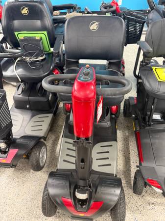 Four-wheel-drive power scooter in red with adjustable seat 1