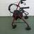 4-wheel  maroon Walker with seat and brakes for sale in Osprey.$55 8 thumbnail