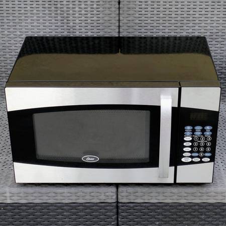 Oster 900W 0.9 Cu Ft midsize countertop household microwave oven 1