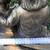 An enchanting siblings reading on bench garden statue 7 thumbnail
