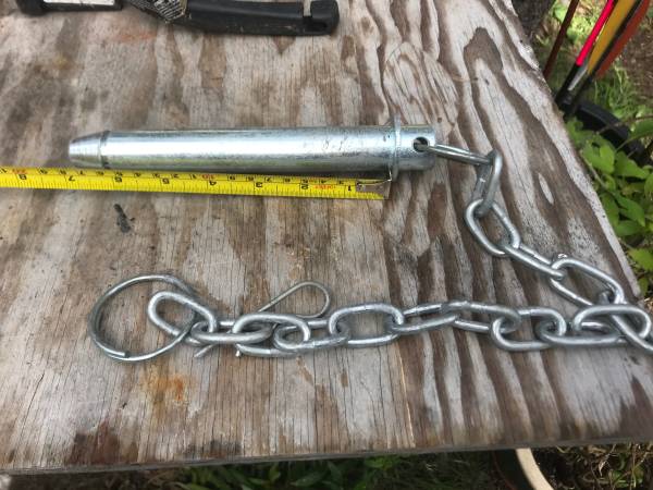 Heavy equipment attachment pins with keeper chain 1