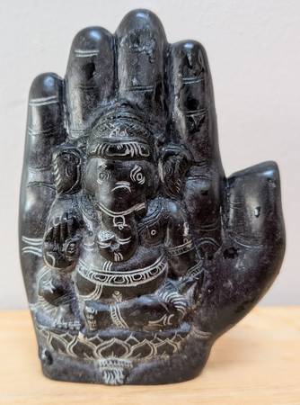 Stone Sculpture of Lord Ganesha depectied on a human hand 1