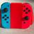 Authentic Nintendo Switch Joy-Con Controllers + Grip Red & Blue 1 thumbnail