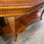 54.5”W Quality two-tiered wood hall console table with a glass top 4 thumbnail