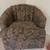 black and brown swivel accent chair featuring scalloped clamshell back and botan 1 thumbnail