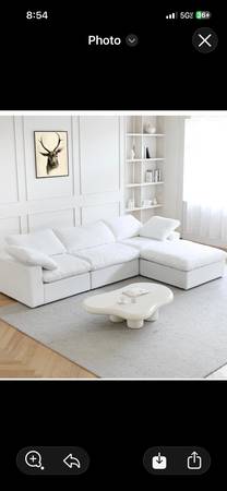 White three piece sectional sofa with ottoman. 1