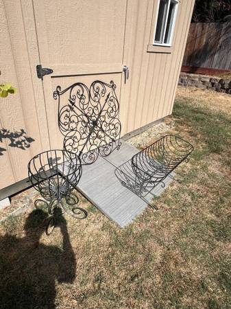wrought iron planters with wall art 1