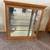 Oak Curio Cabinet with a Light,2 glass Shelves & Glass Side Doors 1 thumbnail