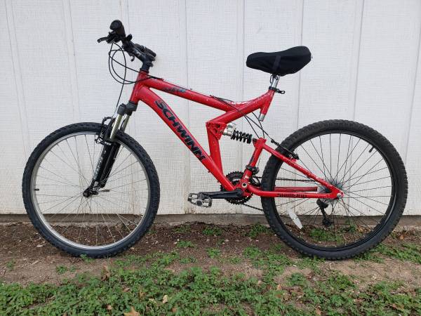 Red Schwinn full suspension trail bike, ready to ride.  5'-5'9" riders 1