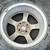 One 15 inch 4 lug Mazda wheel with old tire 2 thumbnail