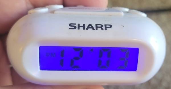 Sharp white liddle travel clock with alarm With blue light 1